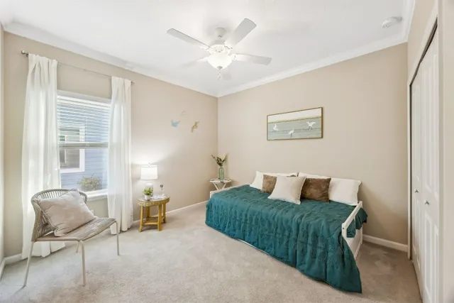 a bedroom with a bed and chair