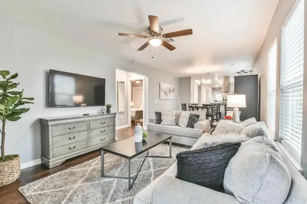 a living room with furniture and a flat screen tv