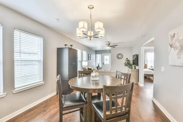 a view of a dining room with furniture window and wooden floor
