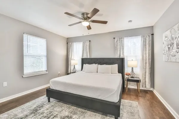 a bedroom with a bed and window