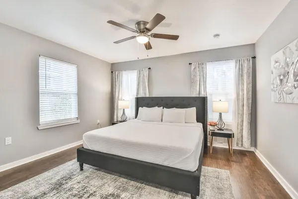 a bedroom with a bed and window