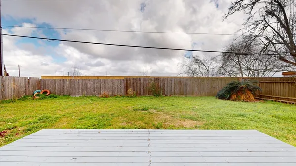 a view of a house with pool and a yard