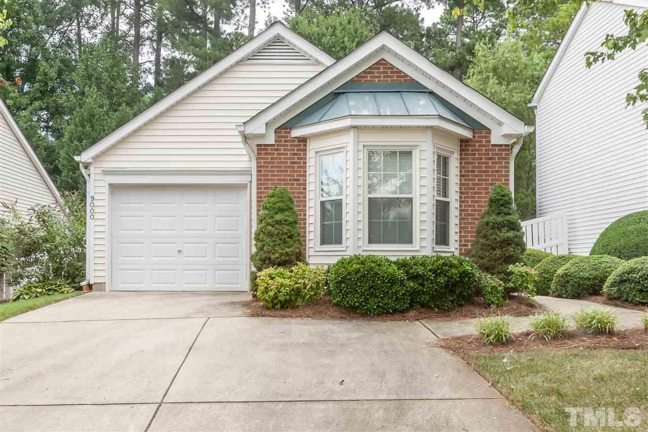 9000 Shallcross Way Raleigh, NC 27617 - Photo 1 of 25 a front view of a house with garden