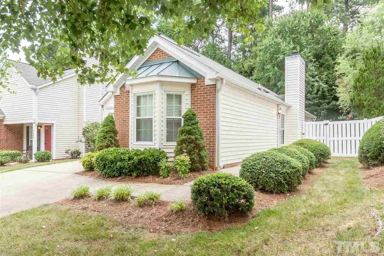9000 Shallcross Way Raleigh, NC 27617 - Photo 2 of 25 a front view of a house with garden