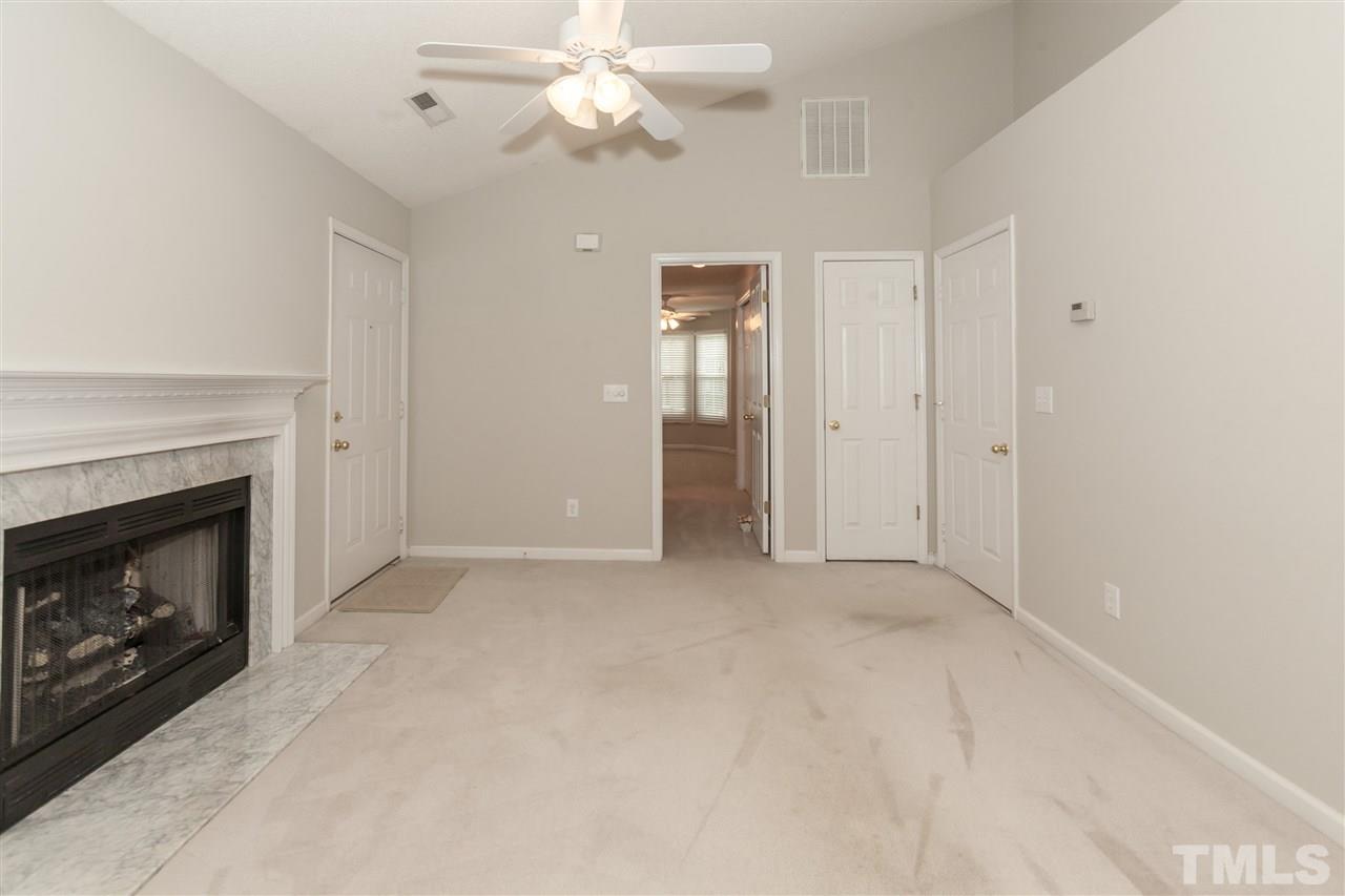 9000 Shallcross Way Raleigh, NC 27617 - Photo 18 of 25 a view of empty room with a fireplace
