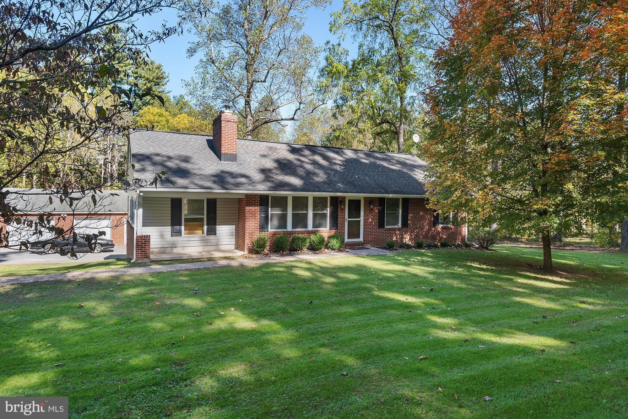 4010 Greenmount Church Road Hampstead, MD 21074 - Photo 1 of 32 a front view of a house with a garden