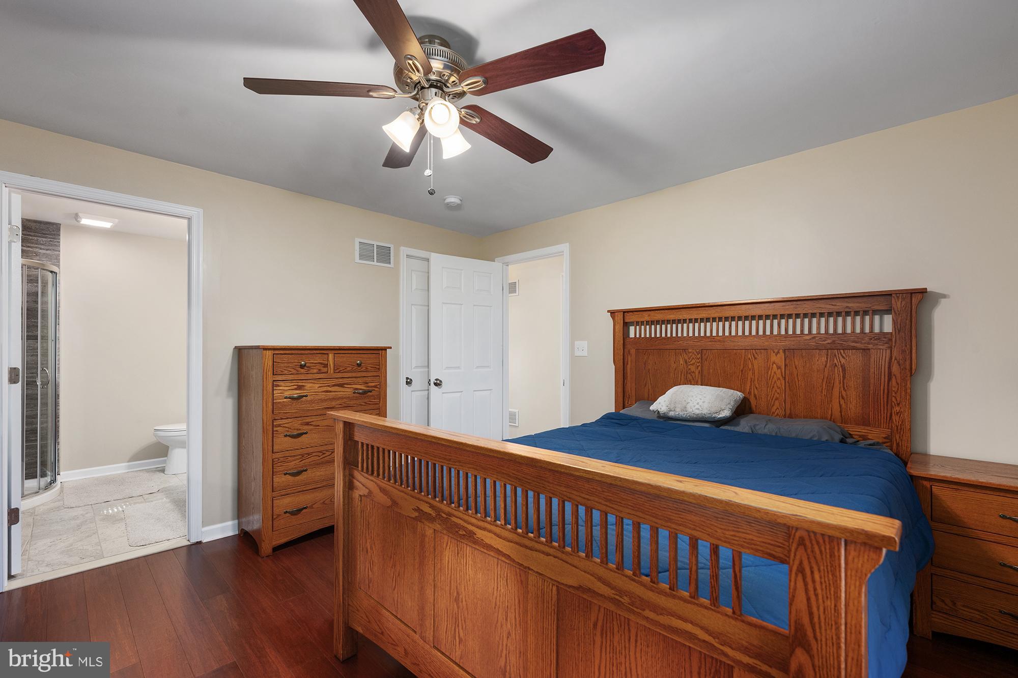 4010 Greenmount Church Road Hampstead, MD 21074 - Photo 15 of 32 a bedroom with a bed and wooden floor