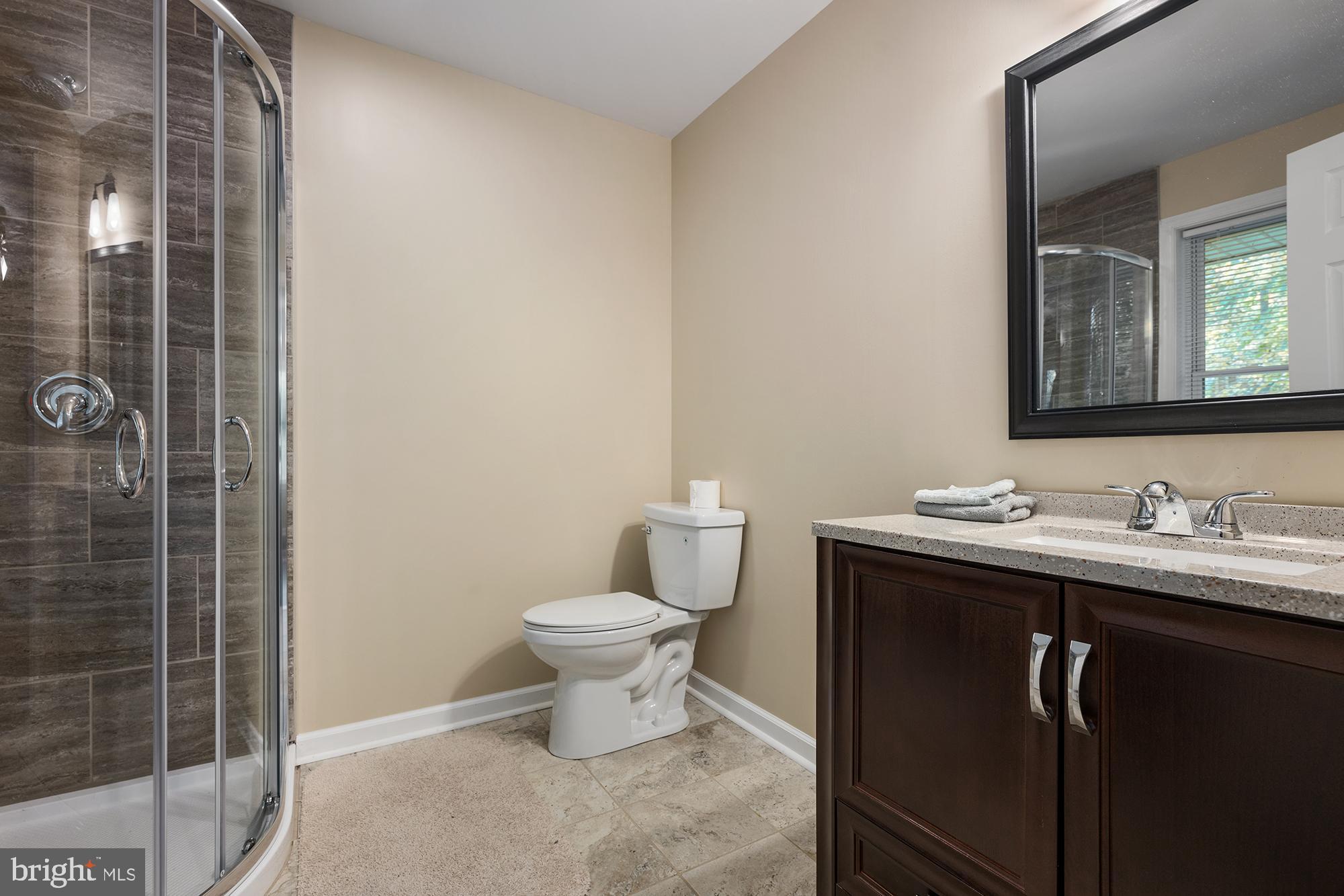 4010 Greenmount Church Road Hampstead, MD 21074 - Photo 17 of 32 a bathroom with a toilet a sink and mirror