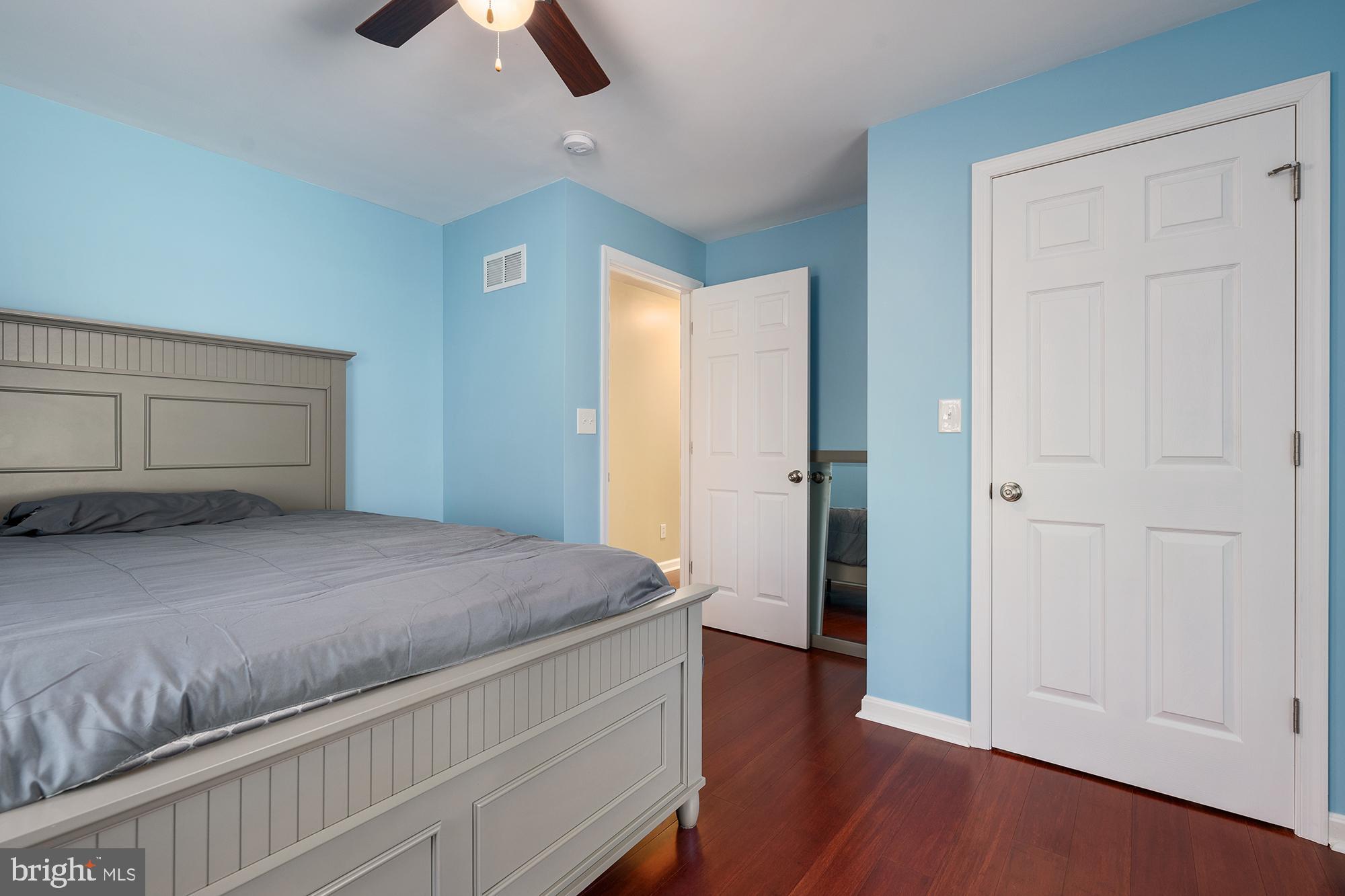 4010 Greenmount Church Road Hampstead, MD 21074 - Photo 21 of 32 a bedroom with a bed and a chandelier fan