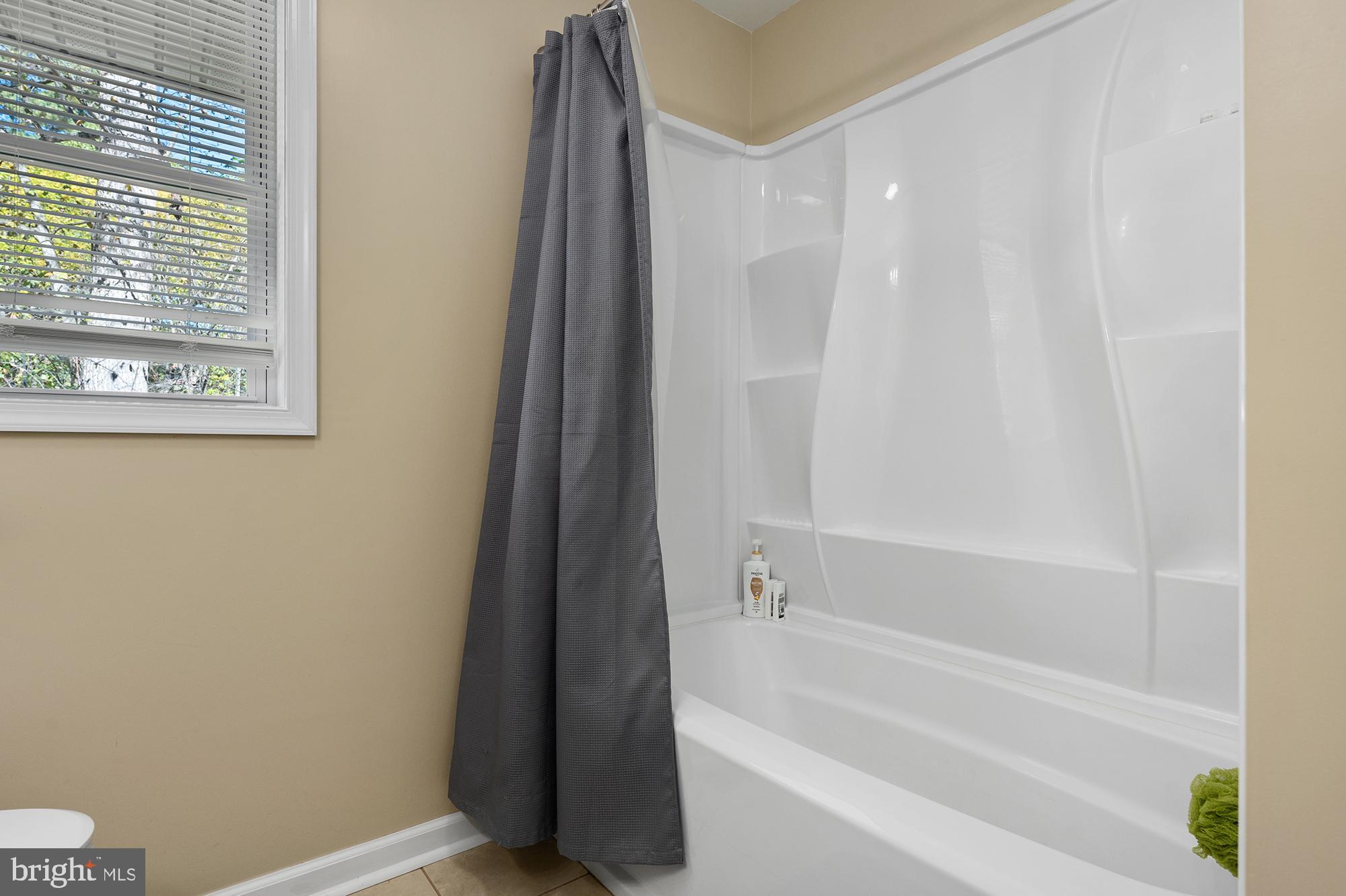 4010 Greenmount Church Road Hampstead, MD 21074 - Photo 23 of 32 a bathroom with a bathtub and a shower