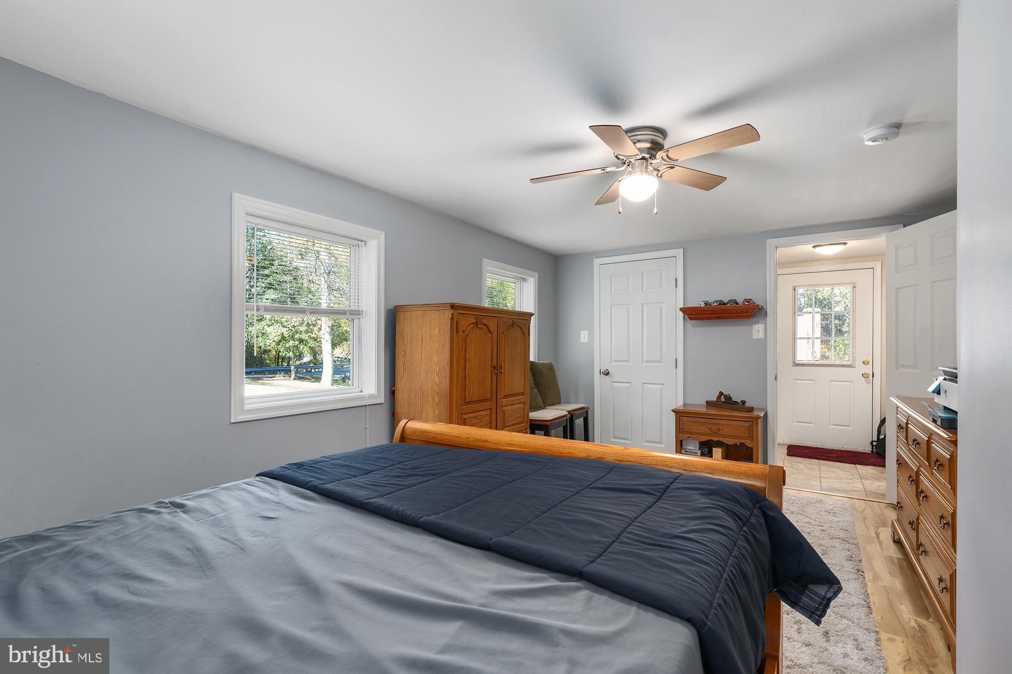 4010 Greenmount Church Road Hampstead, MD 21074 - Photo 25 of 32 a bedroom with a bed and a chandelier