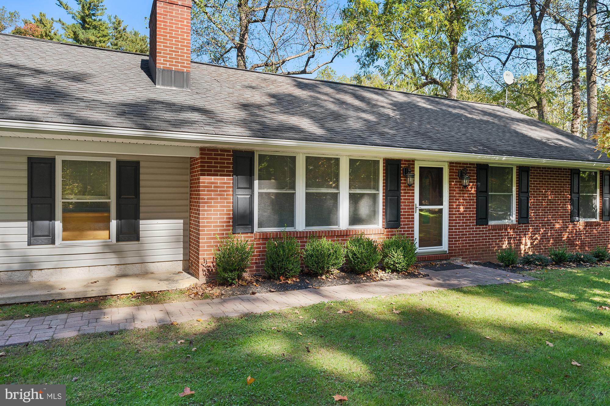4010 Greenmount Church Road Hampstead, MD 21074 - Photo 6 of 32 a front view of a house with a yard and outdoor seating