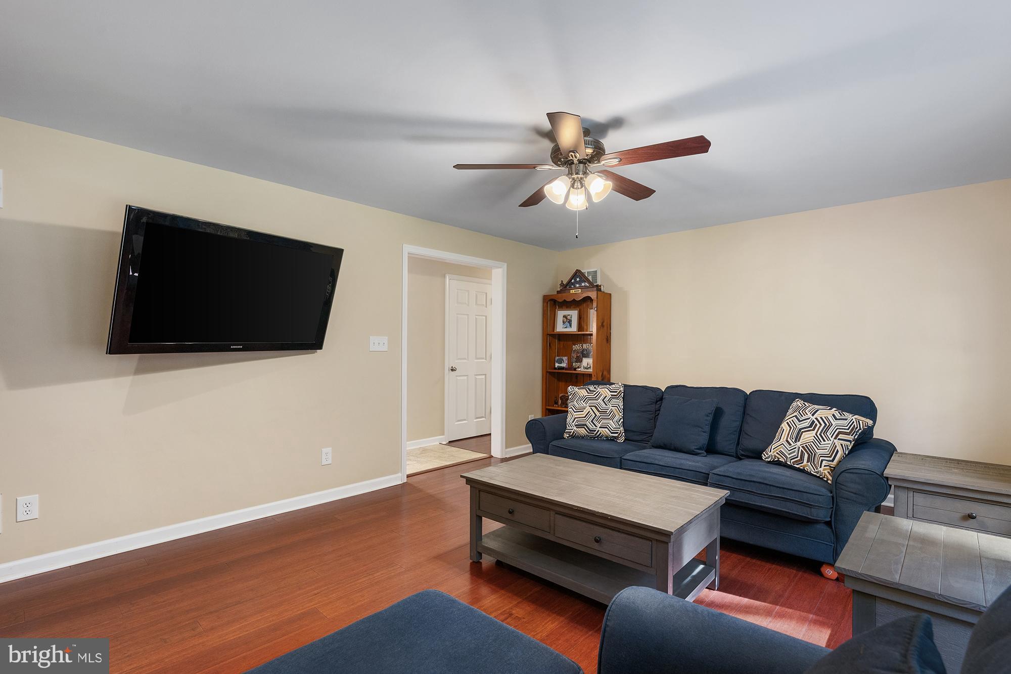 4010 Greenmount Church Road Hampstead, MD 21074 - Photo 8 of 32 a living room with furniture and a flat screen tv