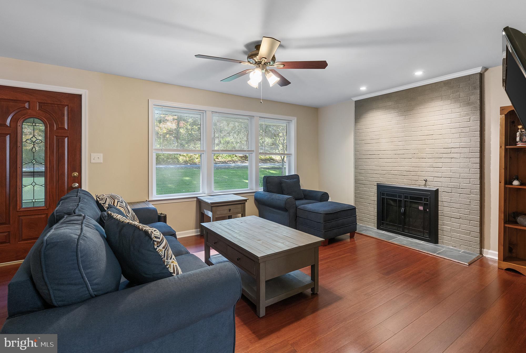 4010 Greenmount Church Road Hampstead, MD 21074 - Photo 9 of 32 a living room with furniture and a fireplace