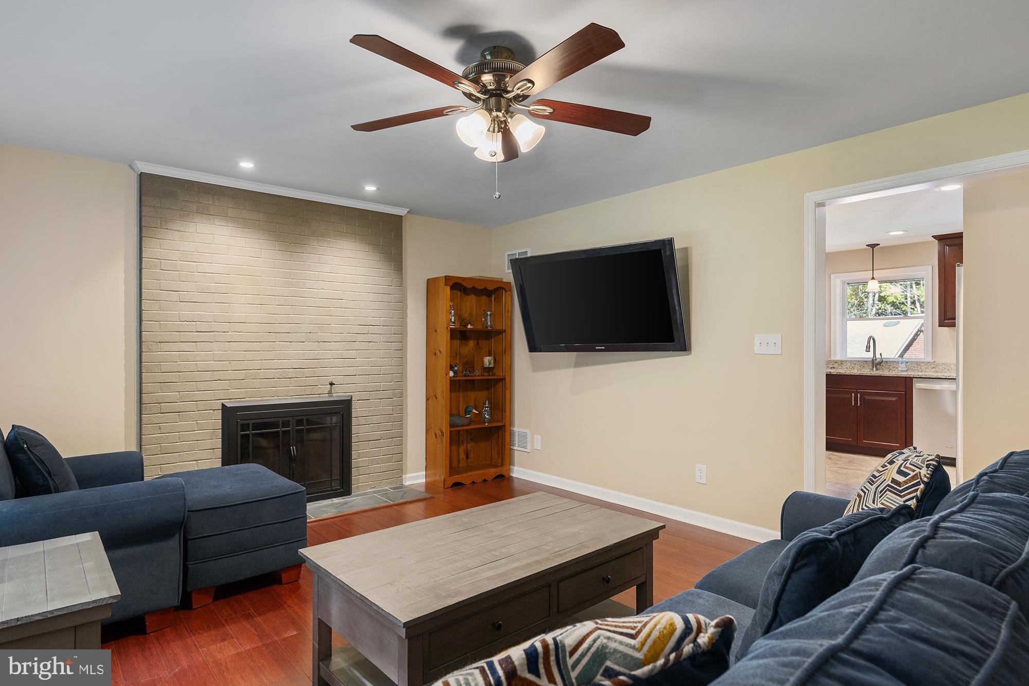 4010 Greenmount Church Road Hampstead, MD 21074 - Photo 10 of 32 a living room with furniture and a flat screen tv