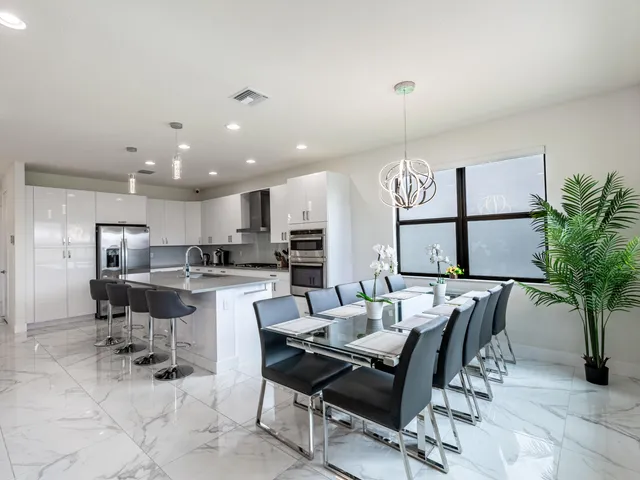 a view of a dining room with furniture window and outside view