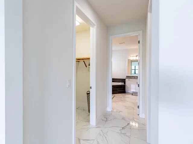 a bathroom with a bathtub a sink and a mirror