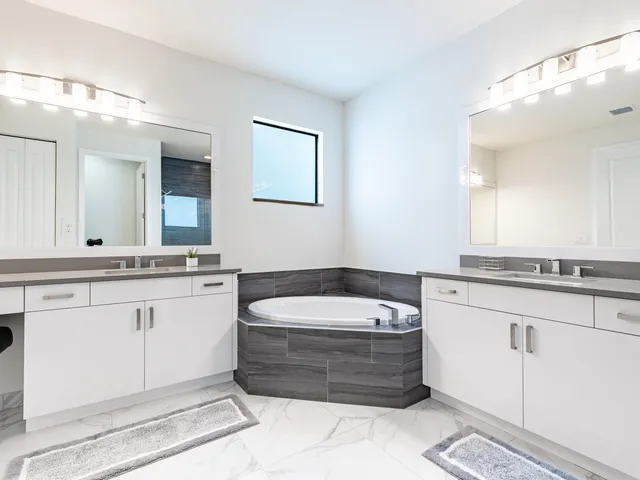 a bathroom with a bathtub and a sink