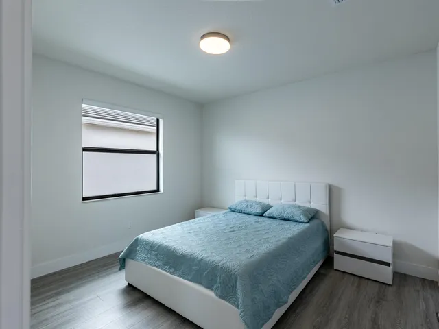 a view of bathroom with a toilet sink and mirror