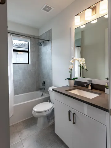 a view of a lake with houses in the back