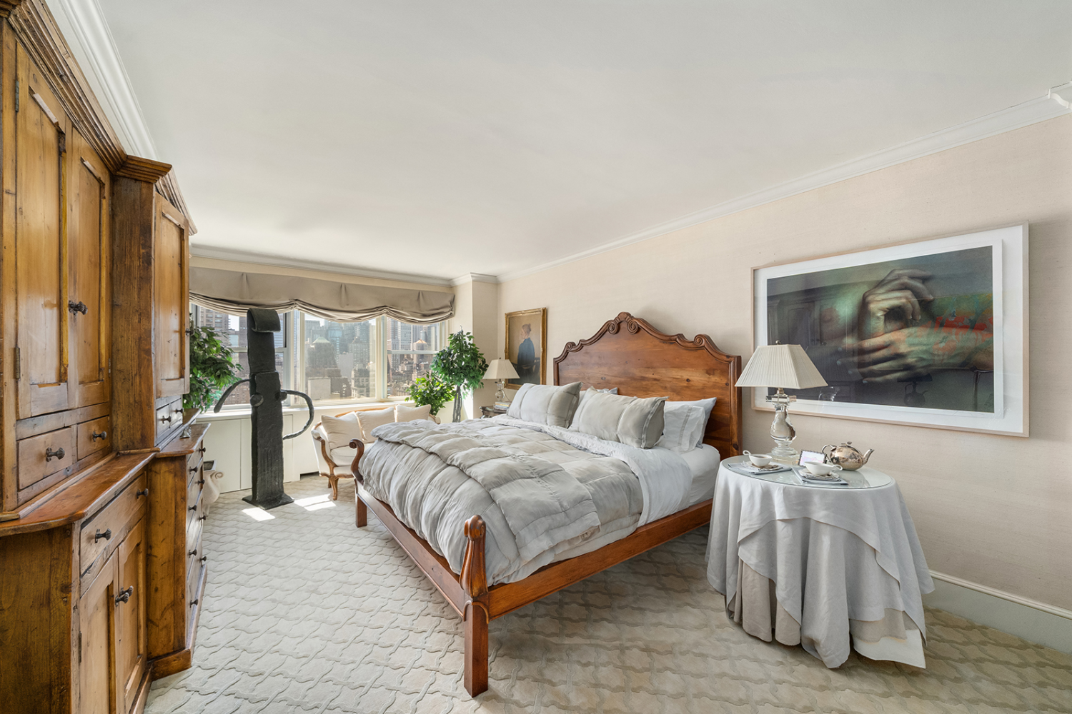 150 East 69th Street, Unit 19N Manhattan, NY 10021 - Photo 7 of 15 a bedroom with bed and glass windows