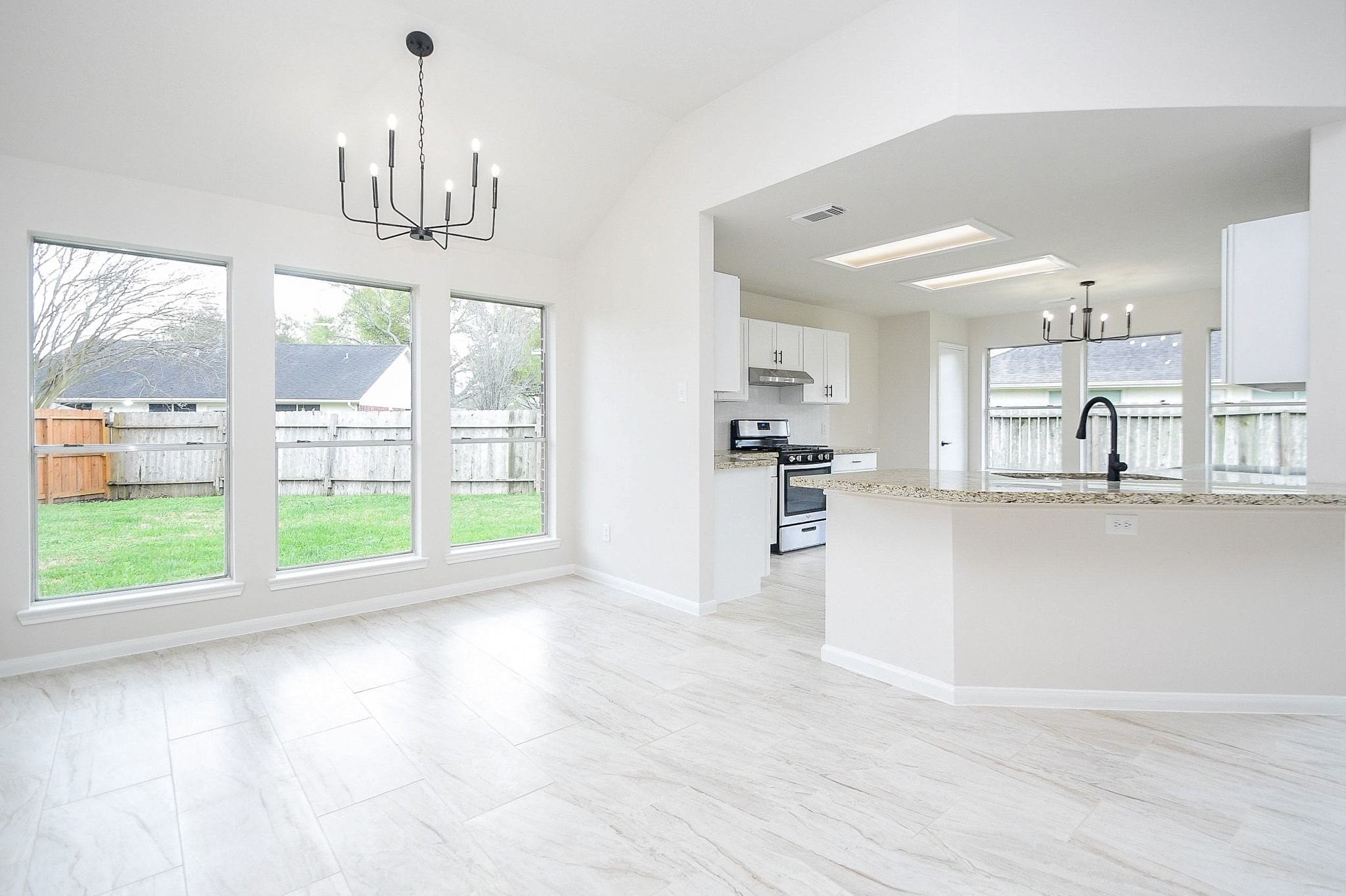 1422 Township Court Rosenberg, TX 77471 - Photo 11 of 32 a view of empty room with wooden floor and windows