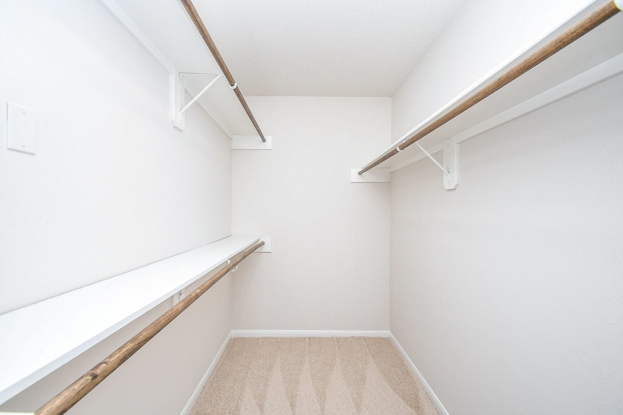 1422 Township Court Rosenberg, TX 77471 - Photo 31 of 32 a view of a room with racks on the wall