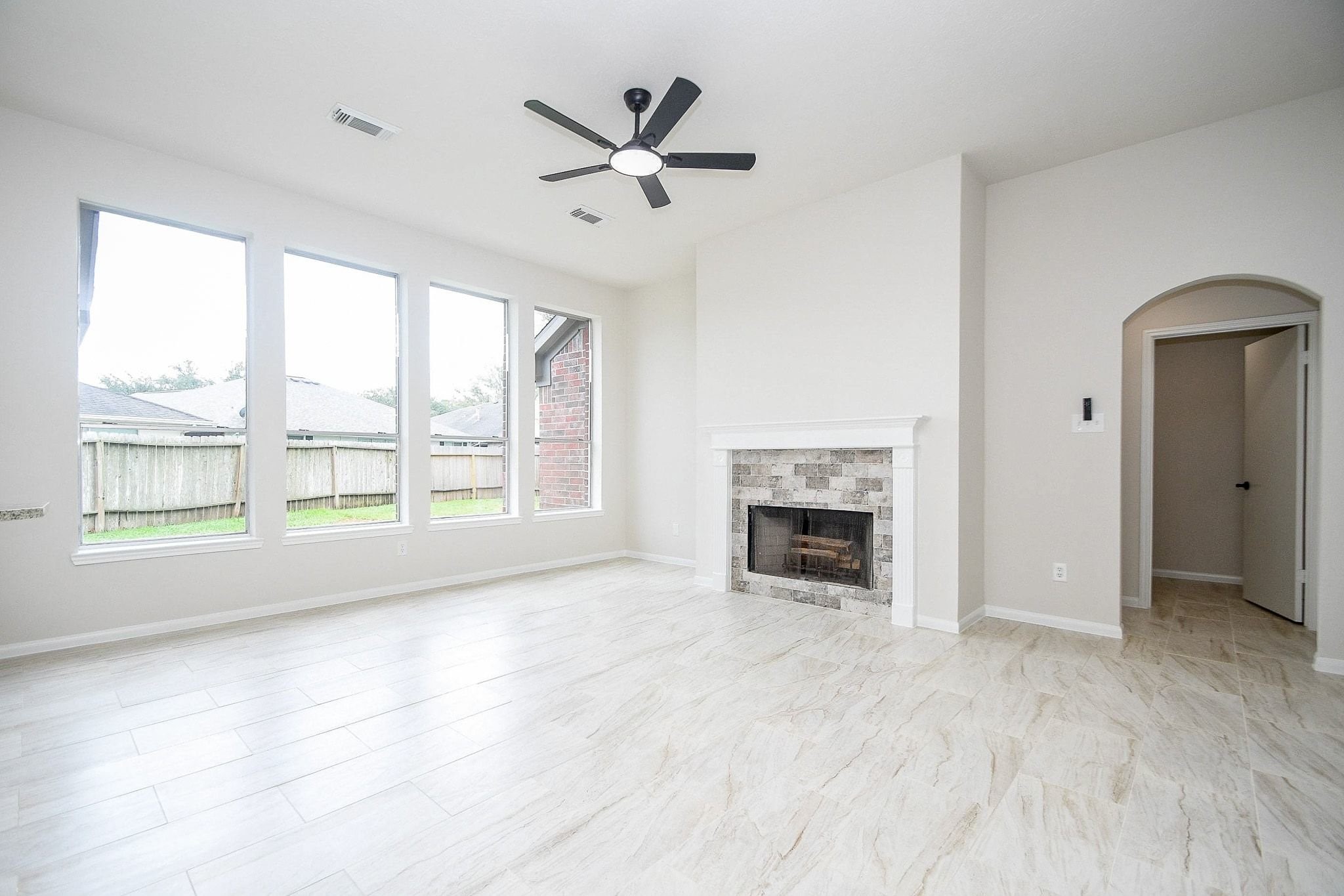 1422 Township Court Rosenberg, TX 77471 - Photo 4 of 32 a view of an empty room with a fireplace and a window