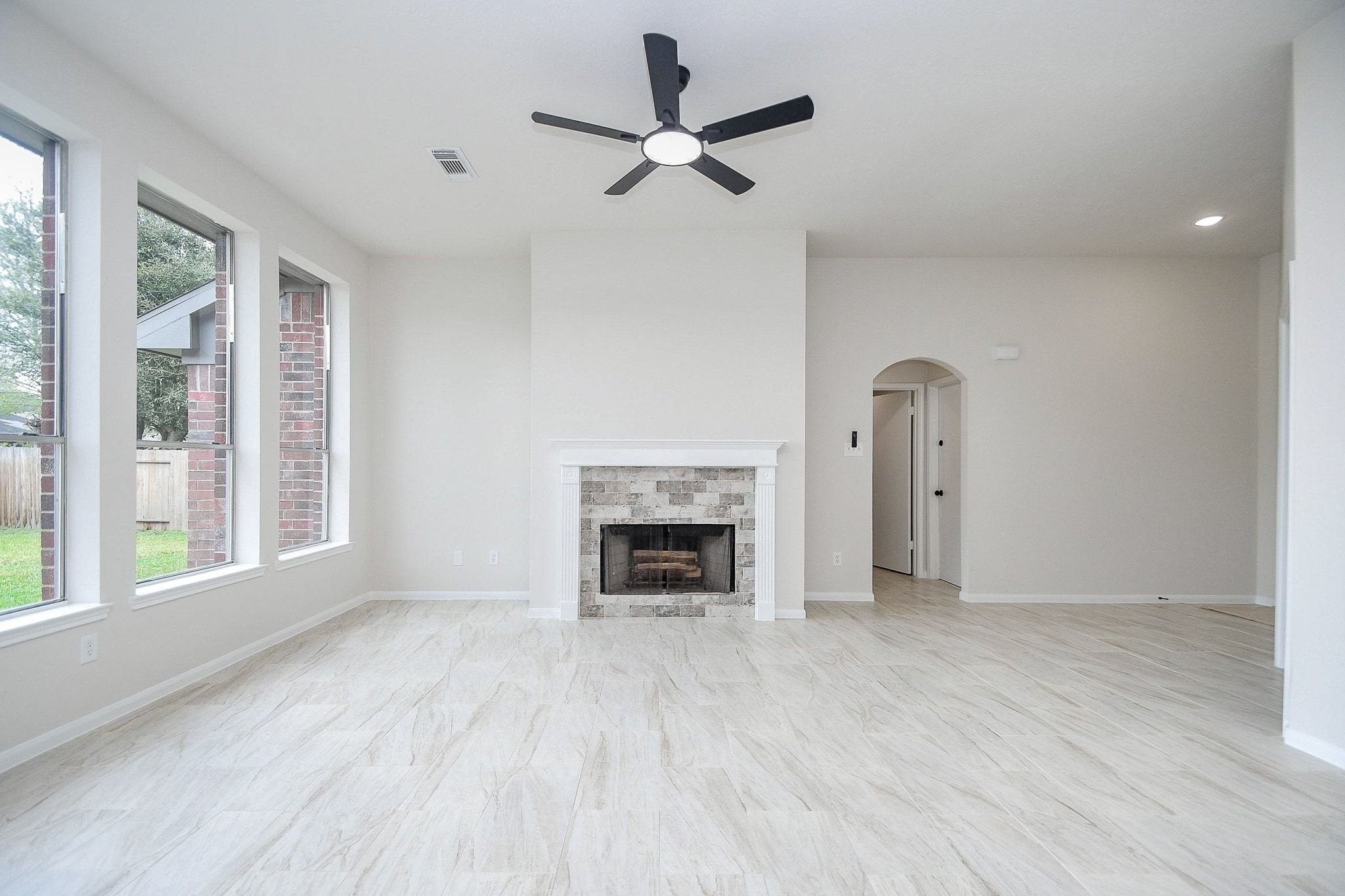 1422 Township Court Rosenberg, TX 77471 - Photo 5 of 32 a view of an empty room with a fireplace and a window