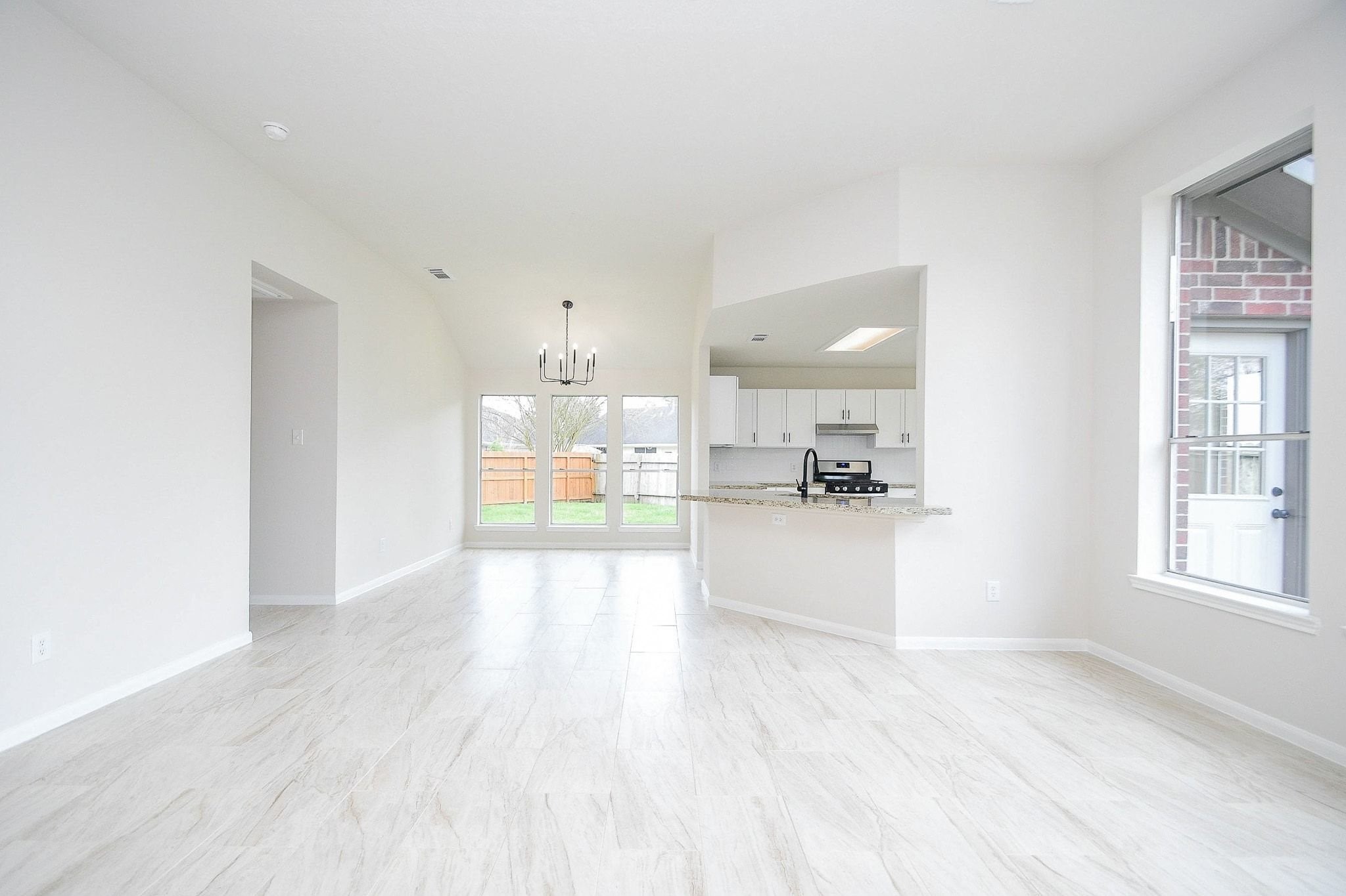 1422 Township Court Rosenberg, TX 77471 - Photo 8 of 32 a view of large kitchen with wooden floor and windows