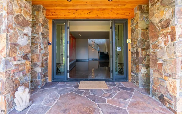front view of a brick house with a glass door