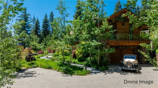 a view of house with outdoor space and sitting area