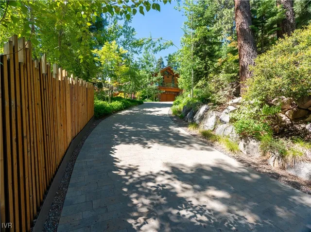 a view of a pathway with a yard