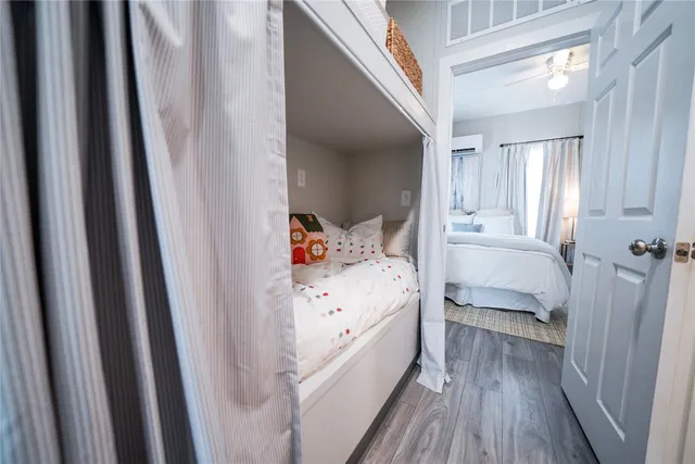 a bathroom with a granite countertop toilet sink and mirror