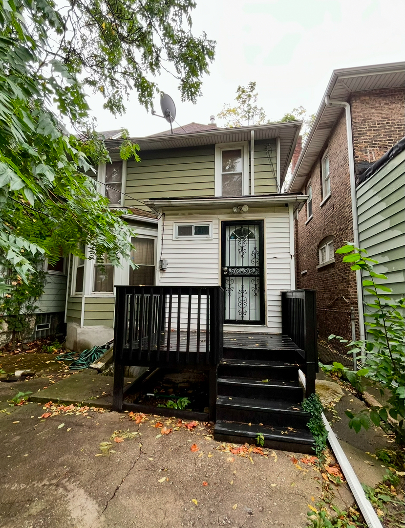 19 South Waller Avenue Chicago, IL 60644 - Photo 14 of 16 a view of a house with a yard