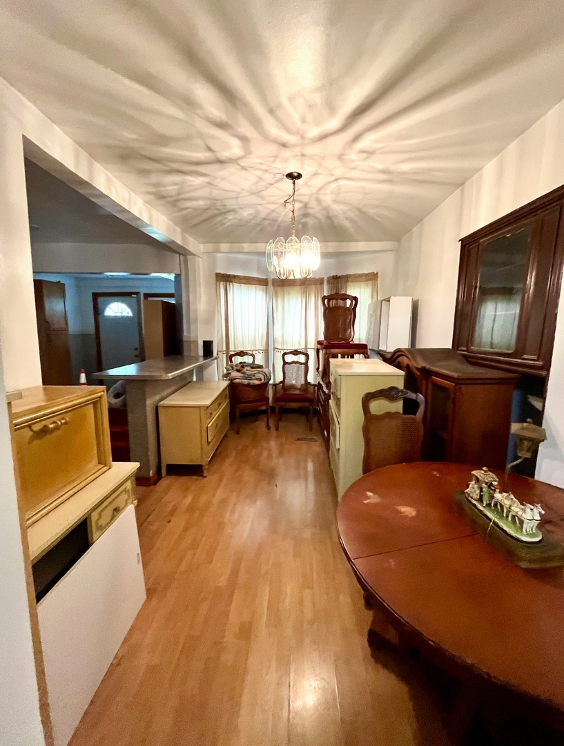 19 South Waller Avenue Chicago, IL 60644 - Photo 7 of 16 a living room with fireplace furniture and a flat screen tv