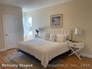 137 Webster Lane, Unit 242 Middletown, CT 06457 - Photo 8 of 17 a bed sitting in a bedroom next to a window