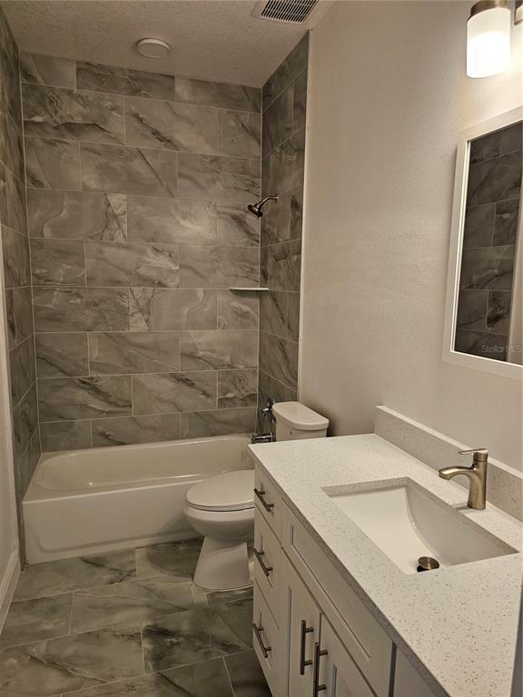 1171 Pine Street Altamonte Springs, FL 32701 - Photo 7 of 14 a bathroom with a sink a toilet and shower
