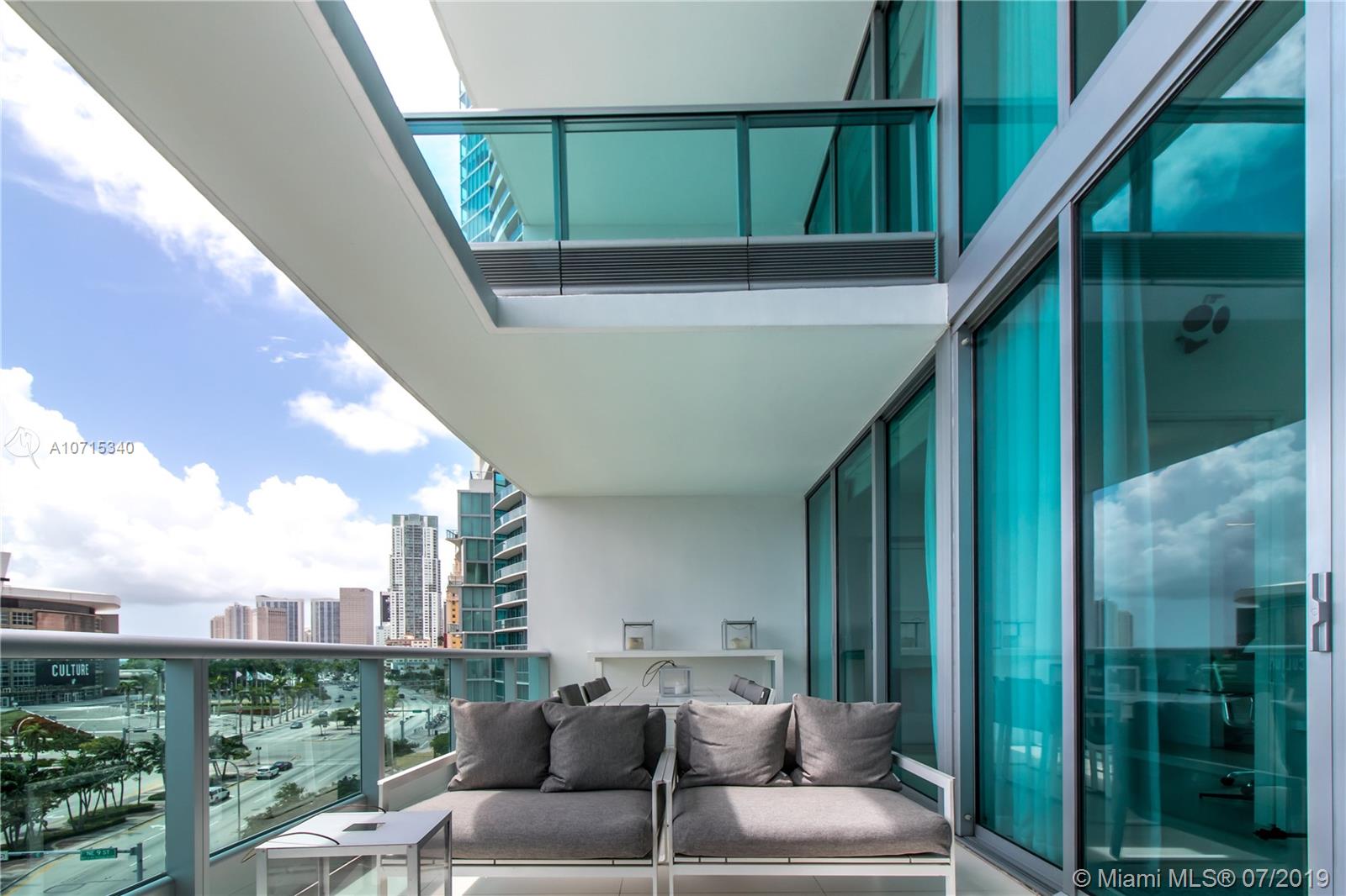 900 Biscayne Boulevard, Unit 705 Miami, FL 33132 - Photo 15 of 43 a balcony with furniture and a potted plant