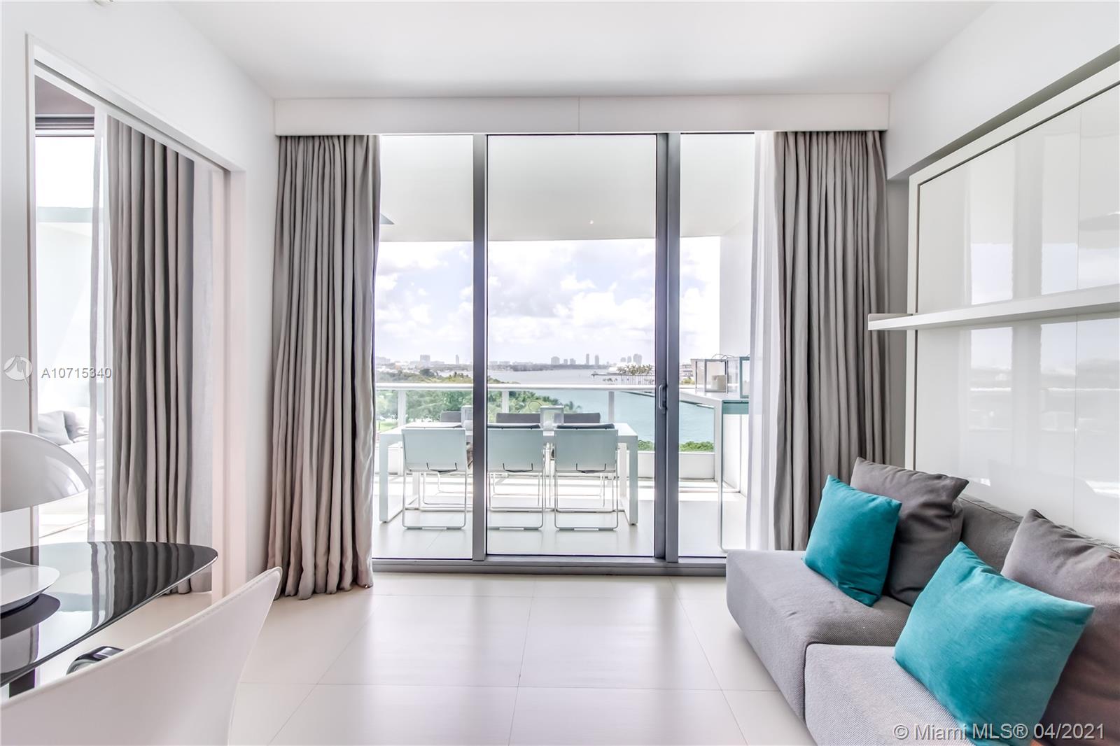 900 Biscayne Boulevard, Unit 705 Miami, FL 33132 - Photo 20 of 43 a living room with furniture and a large window