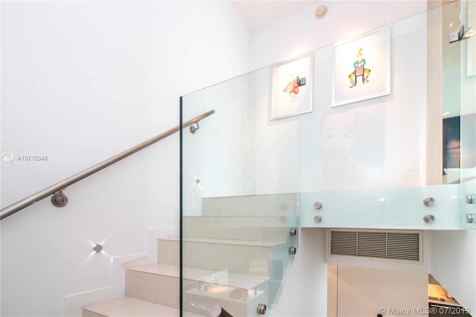 900 Biscayne Boulevard, Unit 705 Miami, FL 33132 - Photo 24 of 43 a bathroom with a shower and a sink