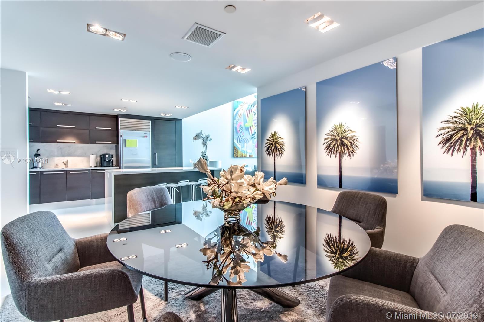 900 Biscayne Boulevard, Unit 705 Miami, FL 33132 - Photo 6 of 43 a living room with furniture and kitchen view