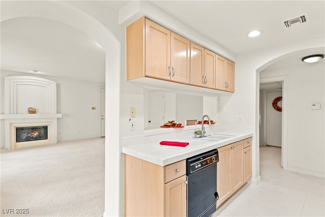 7620 Rolling View Drive, Unit 101 Las Vegas, NV 89149 - Photo 4 of 30 ~YOUR AMAZING GREAT ROOM WITH A GREAT ARCHITECTURAL DETAIL TO YOUR MANTLE AND SURROUND~HIGH CEILINGS~ARCHED ENTRY AREAS~CARPET JUST CLEANED~ALL YOU NEED TO DO IS PUT YOUR PERSONAL TOUCHES AND MAKE IT YOURS~