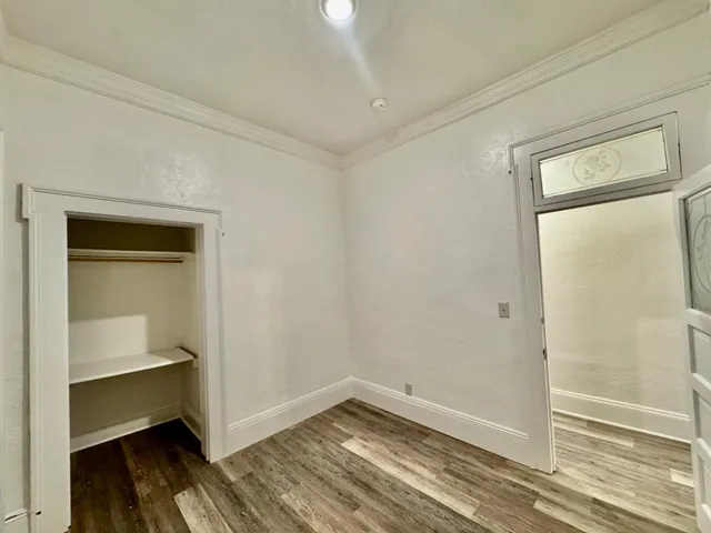 a white toilet sitting next to a bathroom sink