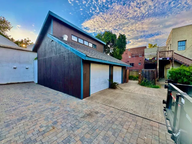 a view of a backyard with sitting area