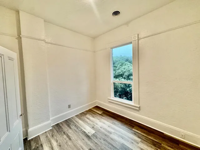 a kitchen with a sink and a refrigerator