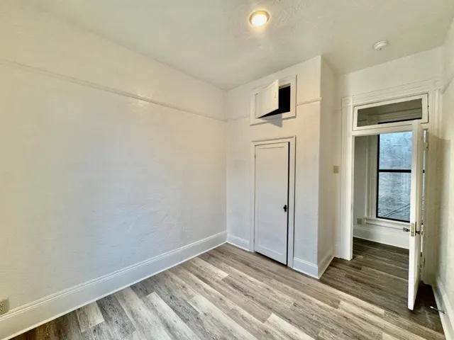 a kitchen with granite countertop a sink and a stove top oven