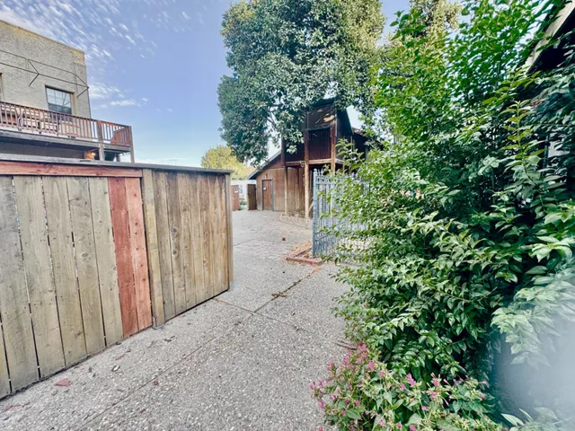 a bathroom with a shower and a sink