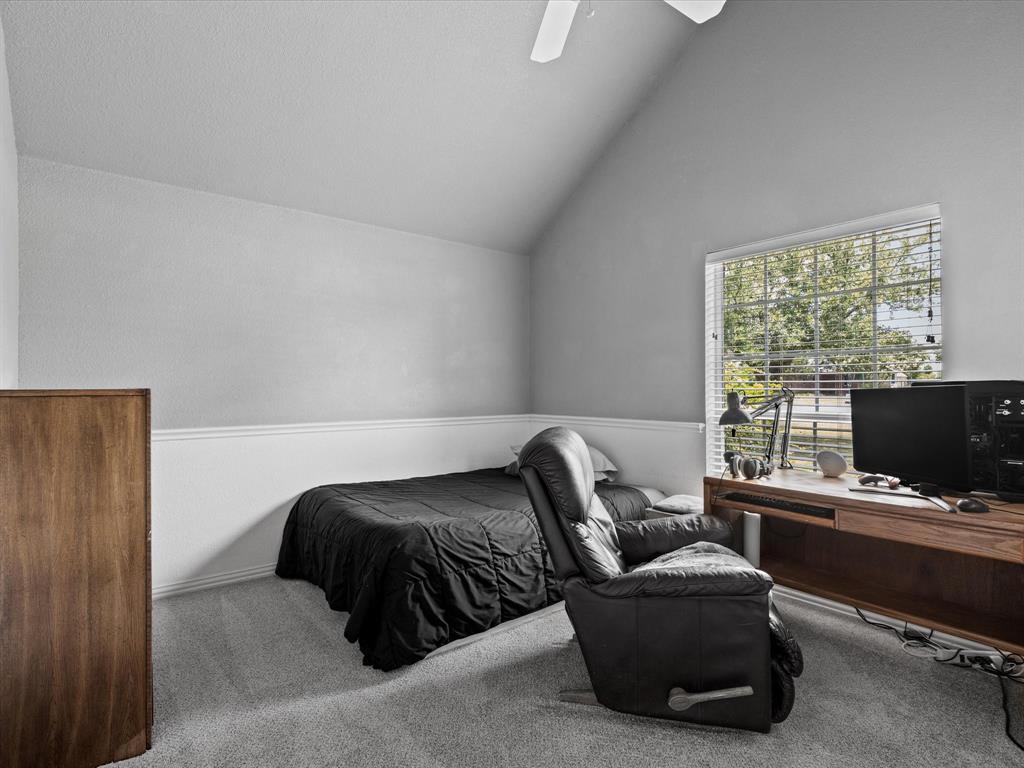 10066 Irish Ridge Forney, TX 75126 - Photo 23 of 39 Carpeted bedroom featuring an office area, ceiling fan, high vaulted ceiling, and wainscoting