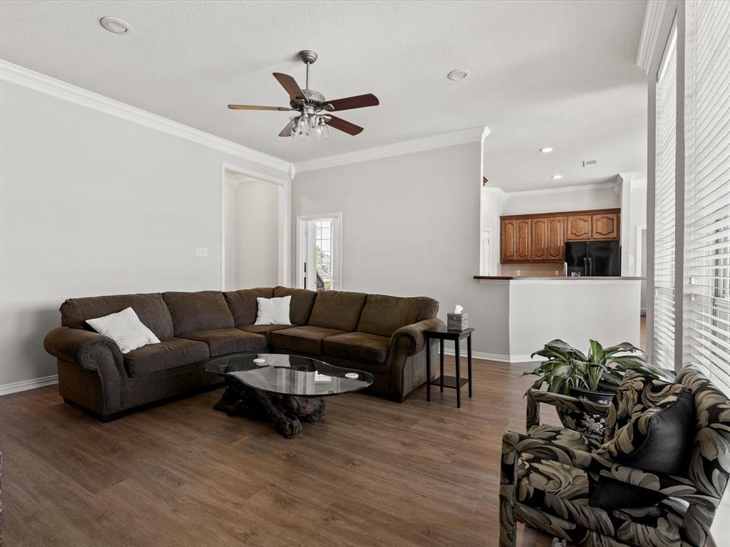 10066 Irish Ridge Forney, TX 75126 - Photo 5 of 39 Living room featuring ornamental molding, wood finished floors, ceiling fan, and recessed lighting